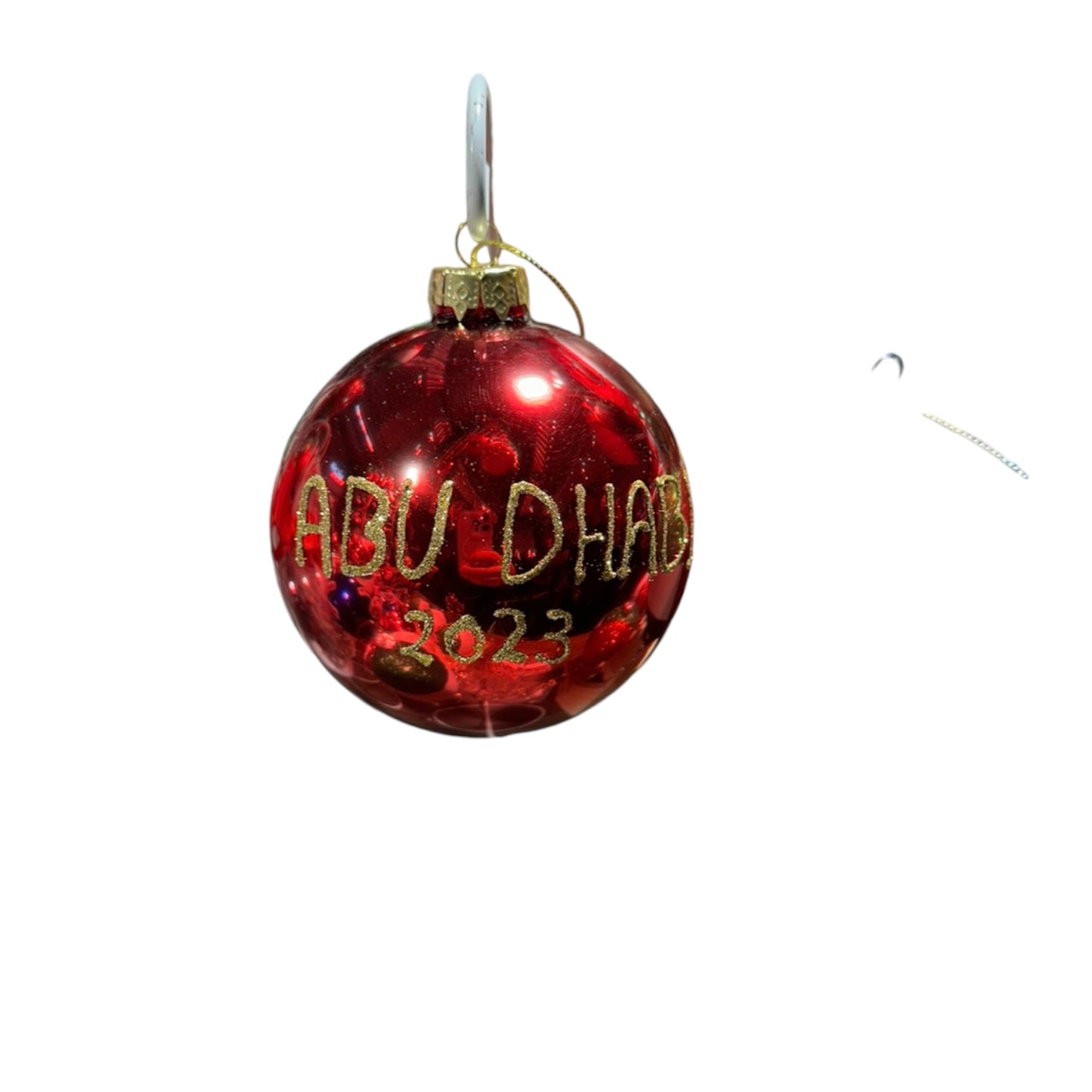 Glossy red ornament with glitter gold name